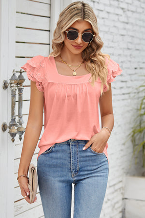 Coral eyelet flutter sleeve square neck blouse with gathered bodice.