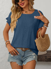 Dusty blue eyelet knit blouse with ruffled short sleeves and a round neckline.