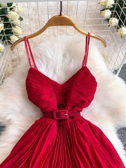 Red belted midi dress with spaghetti straps and pleated skirt