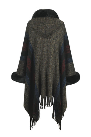 Textured stripe knit poncho with faux fur trim and fringe detail.