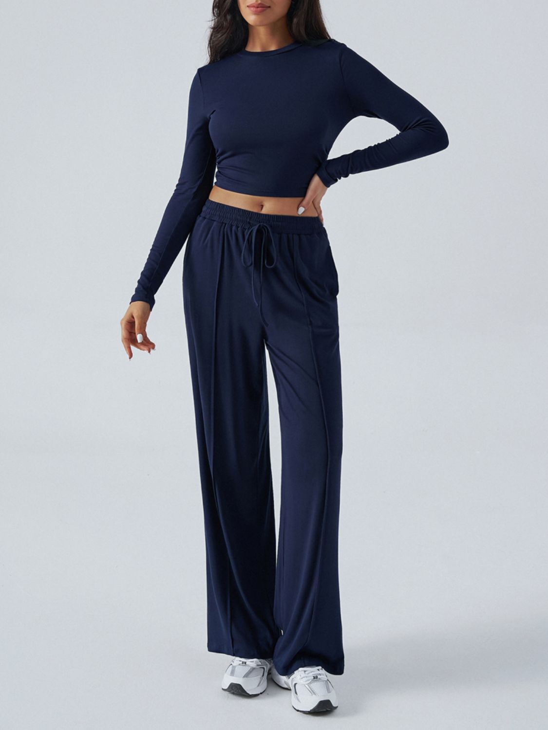 Dark blue ribbed knit crop top and wide leg pants set with drawstring waist.