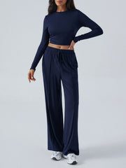 Dark blue ribbed knit crop top and wide leg pants set with drawstring waist.