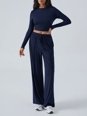 Dark blue ribbed knit crop top and wide leg pants set with drawstring waist.