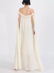 Elegant cream off-shoulder maxi dress with floral applique neckline and cape sleeves