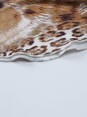 Lace trim cami and skirt set detail with leopard print fabric and wavy hem.