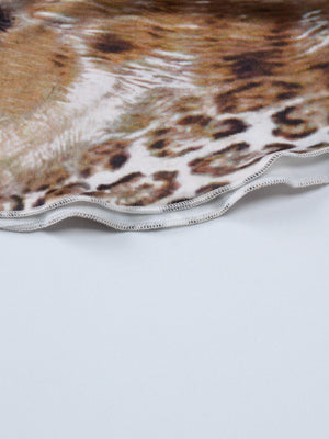 Lace trim cami and skirt set detail with leopard print fabric and wavy hem.