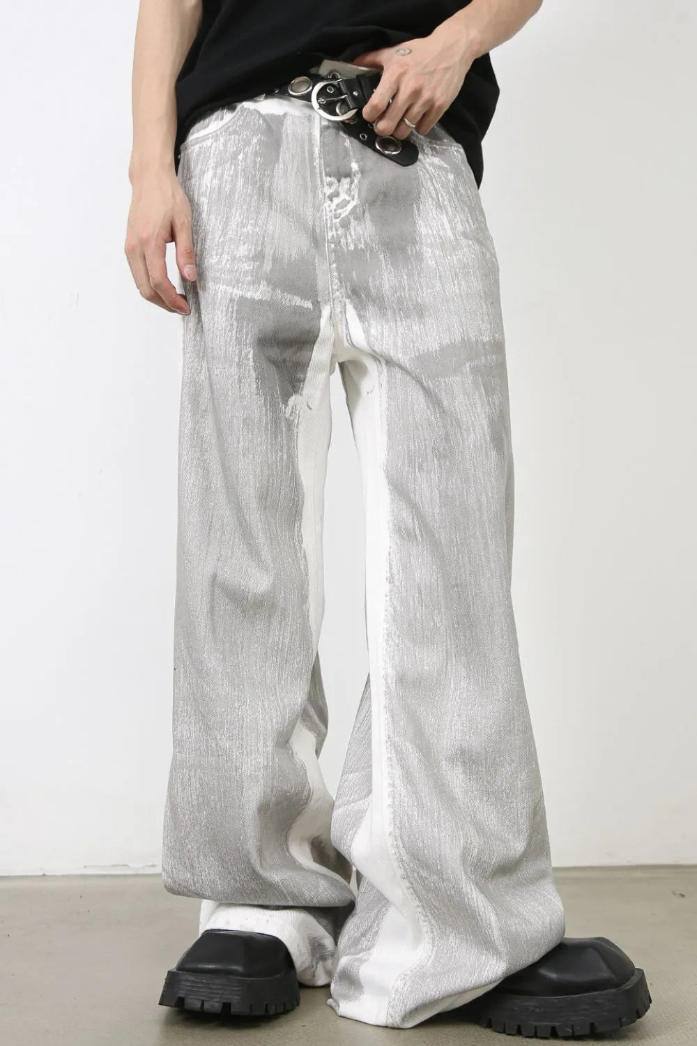 Metallic panel wide leg trousers in light with a distressed, abstract pattern.
