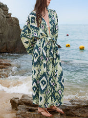 Green boho print maxi beach cover-up with tie waist and wide sleeves.