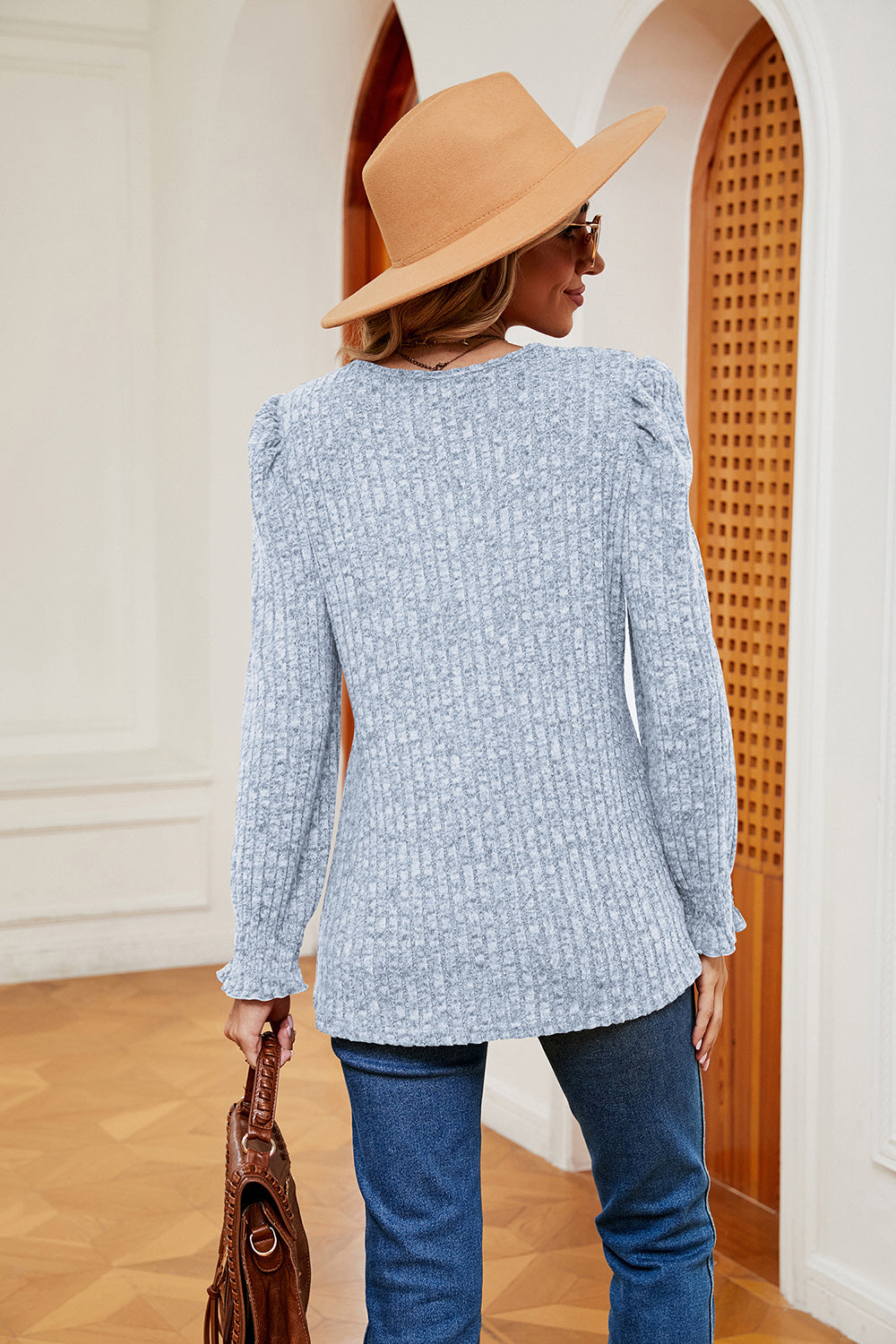 Light gray textured knit blouse with square neckline, puffed sleeves, and cuffed wrists.