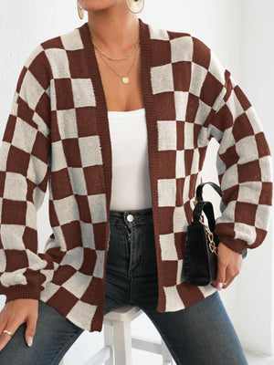 Checkerboard knit cardigan in brown and white with balloon sleeves and open front.