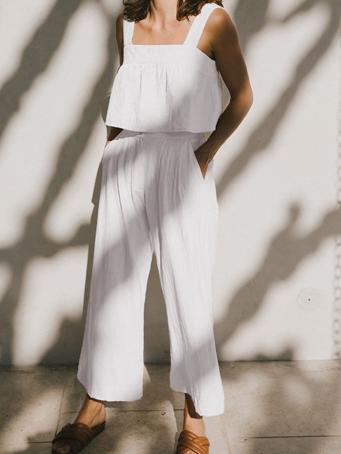 White linen crop top and culotte co-ord set with square neckline and wide leg pants.