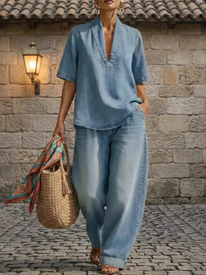 Blue denim V-neck top and wide-leg pants set with cuffed ankles and curved hem