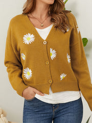 Mustard V-neck cardigan with all-over daisy embroidery and button front.
