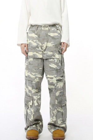 Oversized camo utility trousers in gray with multiple cargo pockets.