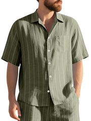 Olive striped cotton camp collar shirt with short sleeves and chest pocket.