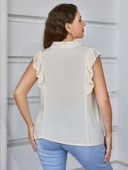Light yellow collared blouse with ruffled cap sleeves.