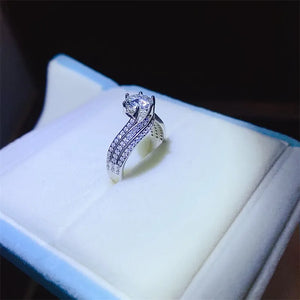 Silver swirl band ring with moissanite and pave diamond accents