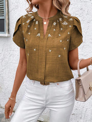 Camel embroidered floral keyhole blouse with short sleeves and a V-neckline.