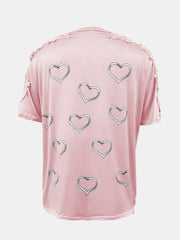 Blush pink t-shirt with heart print and lace trim detail on shoulders and sleeves.