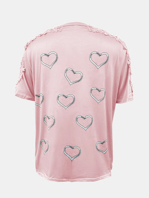 Blush pink t-shirt with heart print and lace trim detail on shoulders and sleeves.