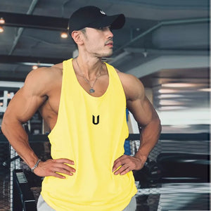 Yellow performance scoop neck tank top with black logo detail