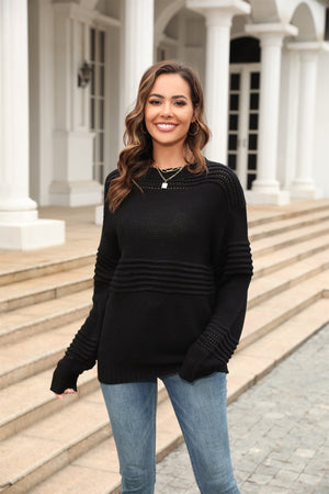 Black openwork ribbed knit sweater with horizontal stripe detail and crew neck.