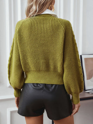 Matcha green cable knit sweater with blouson sleeves and ribbed details.