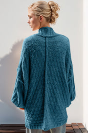 Cerulean textured bouclé cocoon cardigan with balloon sleeves and mock neck.