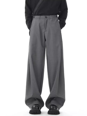 Men's dark gray flowy wide-leg sweatpants with button closure and a relaxed fit.