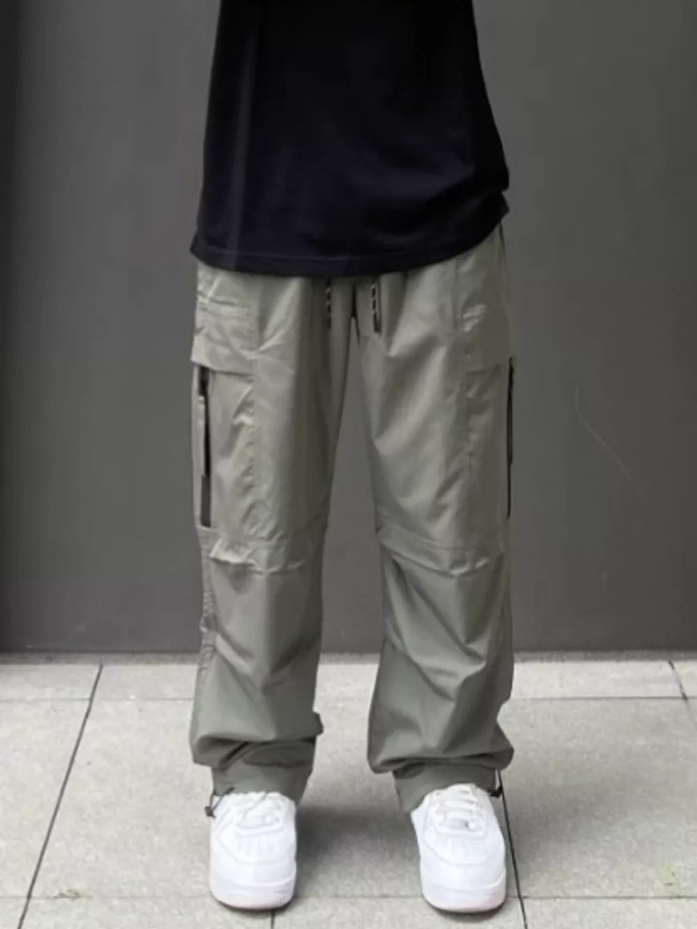 Men's Gray Green relaxed fit cargo sweatpants with ankle drawstring and multiple pockets.