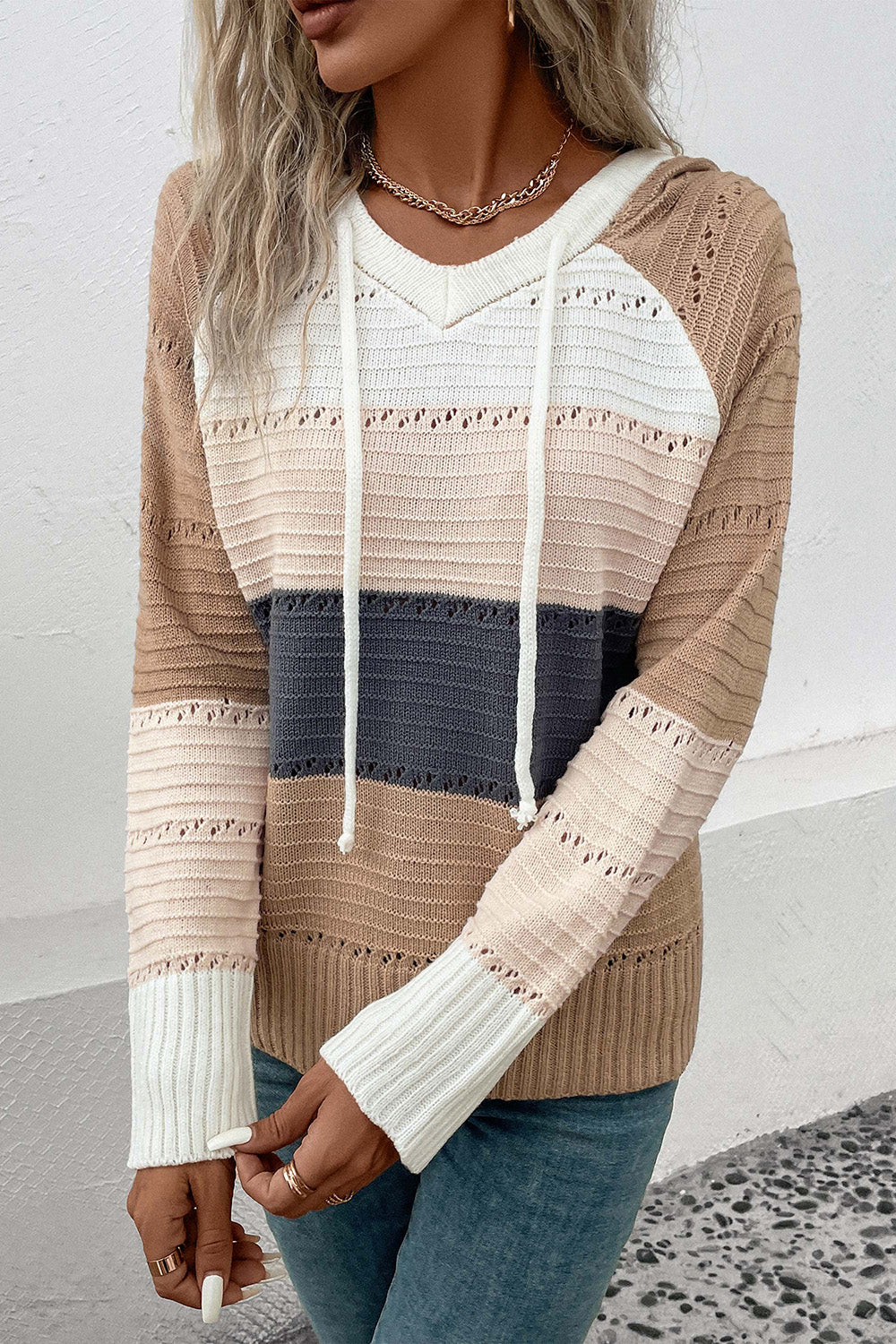Striped knit hooded sweater in khaki with open knit details and adjustable drawstrings.