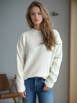 Cream textured knit crew neck pullover sweater with ribbed cuffs and hem.