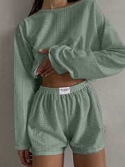 Matcha green perforated crop top and shorts set with a relaxed fit.