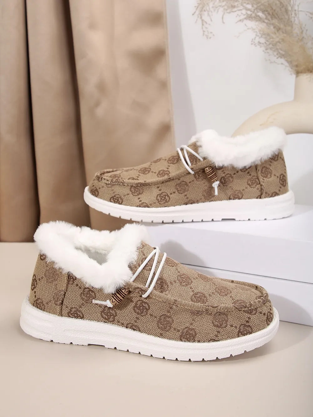 Southwestern print faux fur lined loafers in taupe with white laces and wooden bead detail.