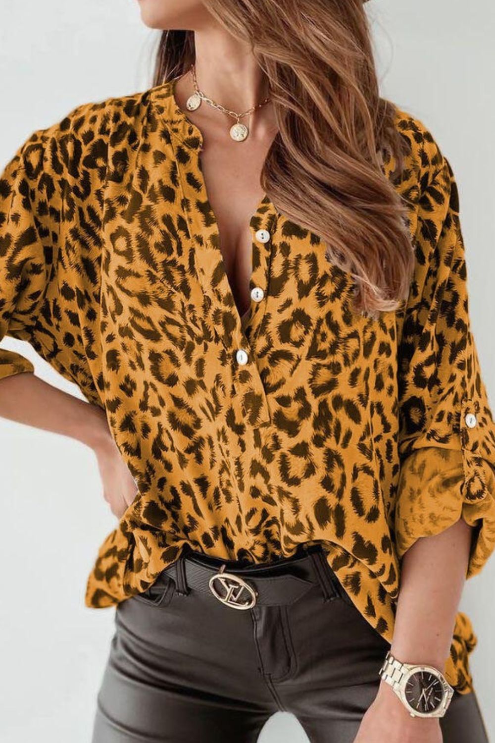 Mustard leopard print henley blouse with rolled sleeves and button detail