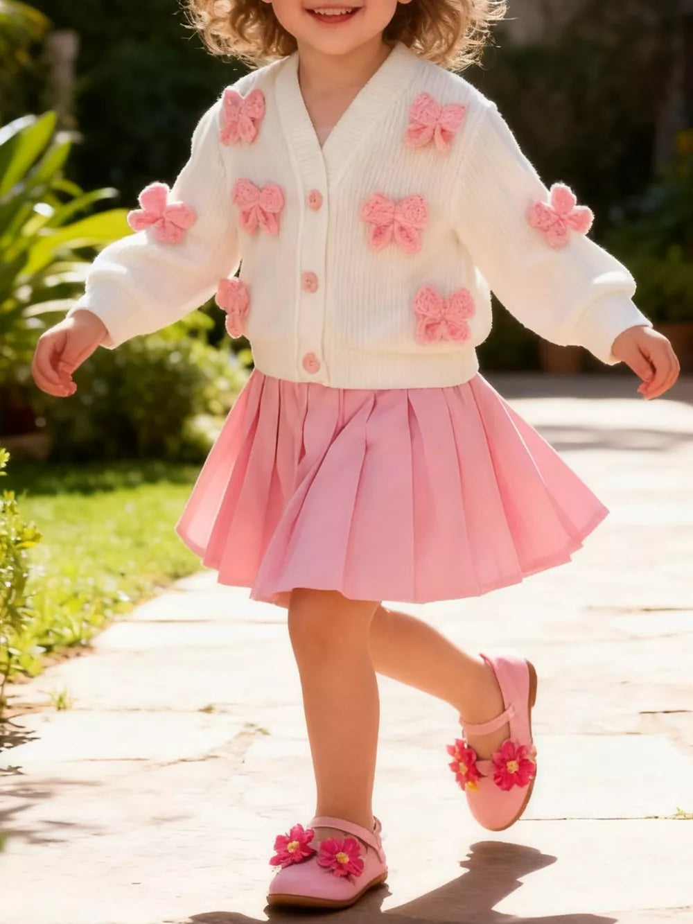 Children's Bow Button Up Cardigan And Pleated Skirt Set in Pink, front view