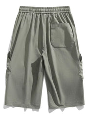 Light gray cargo capris with elastic waistband and drawstring, featuring side pockets and a back pocket.