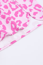 Pink leopard print shorts with scalloped hem detail