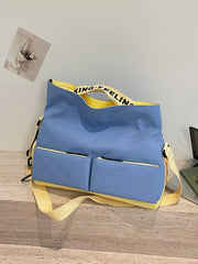 Blue Oxford cloth travel bag with yellow trim and strap, featuring two front zip pockets.