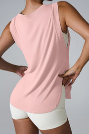 Blush pink performance tank top with asymmetric hemline and relaxed fit.