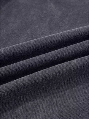 Dark grey cotton maternity trousers with a textured, washed finish and wide-leg cut.