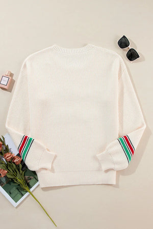Ivory knit sweater with striped cuffs, crew neck, and long sleeves.
