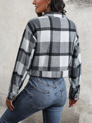 Checked plaid shacket in dark gray with buttoned cuffs and collar.