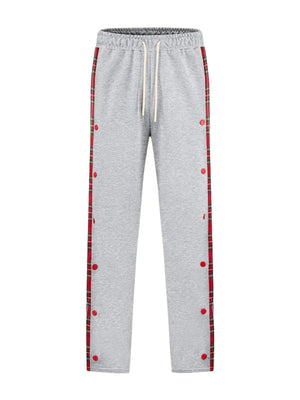 Light gray sweatpants with plaid snap-button trim and drawstring waist.