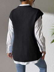 Black ribbed knit sleeveless vest over white shirt