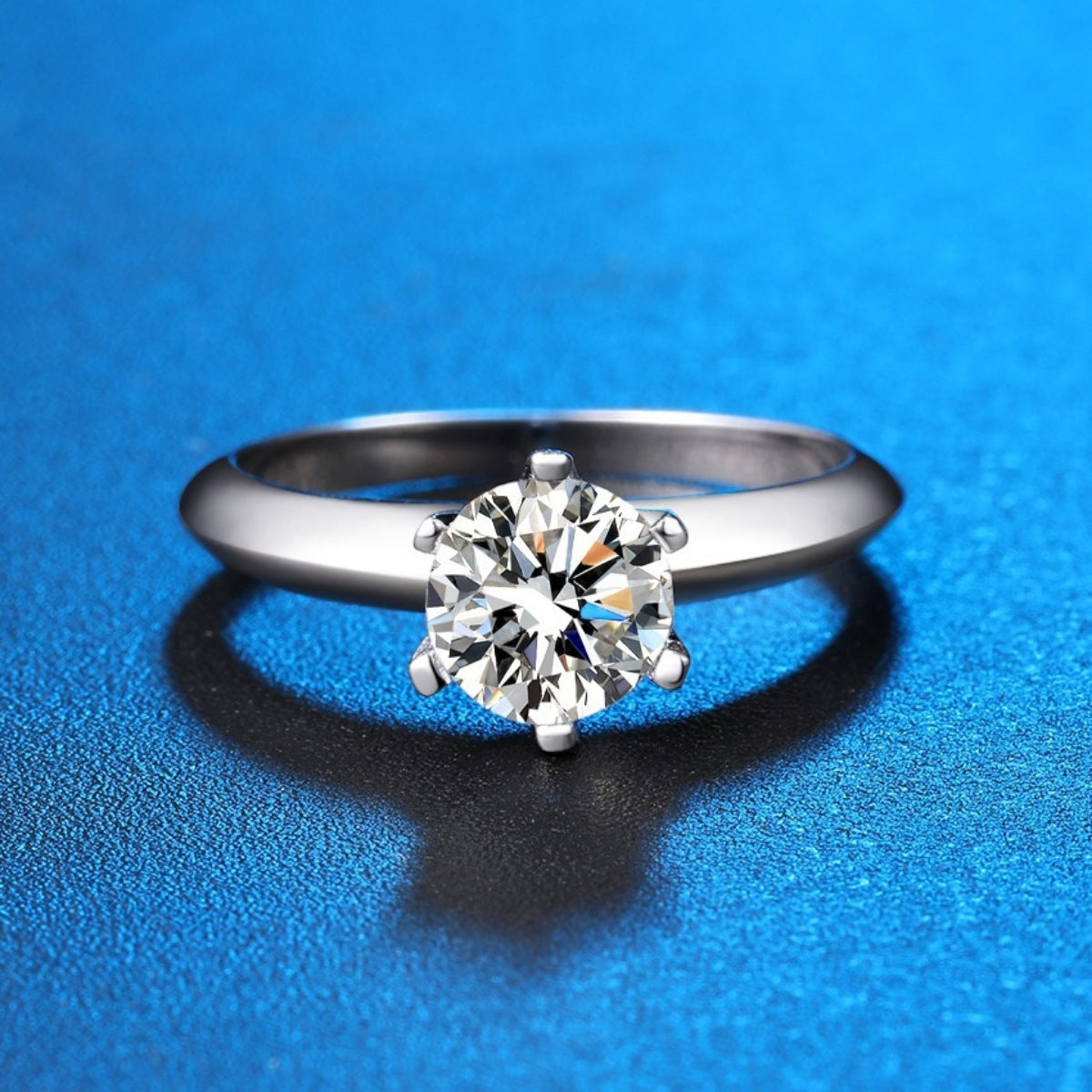 Sterling silver ring with a brilliant cut moissanite solitaire stone.