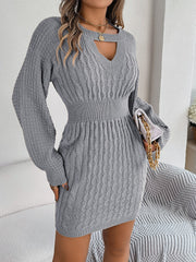 Charcoal cable knit mini dress with keyhole neckline and long sleeves.