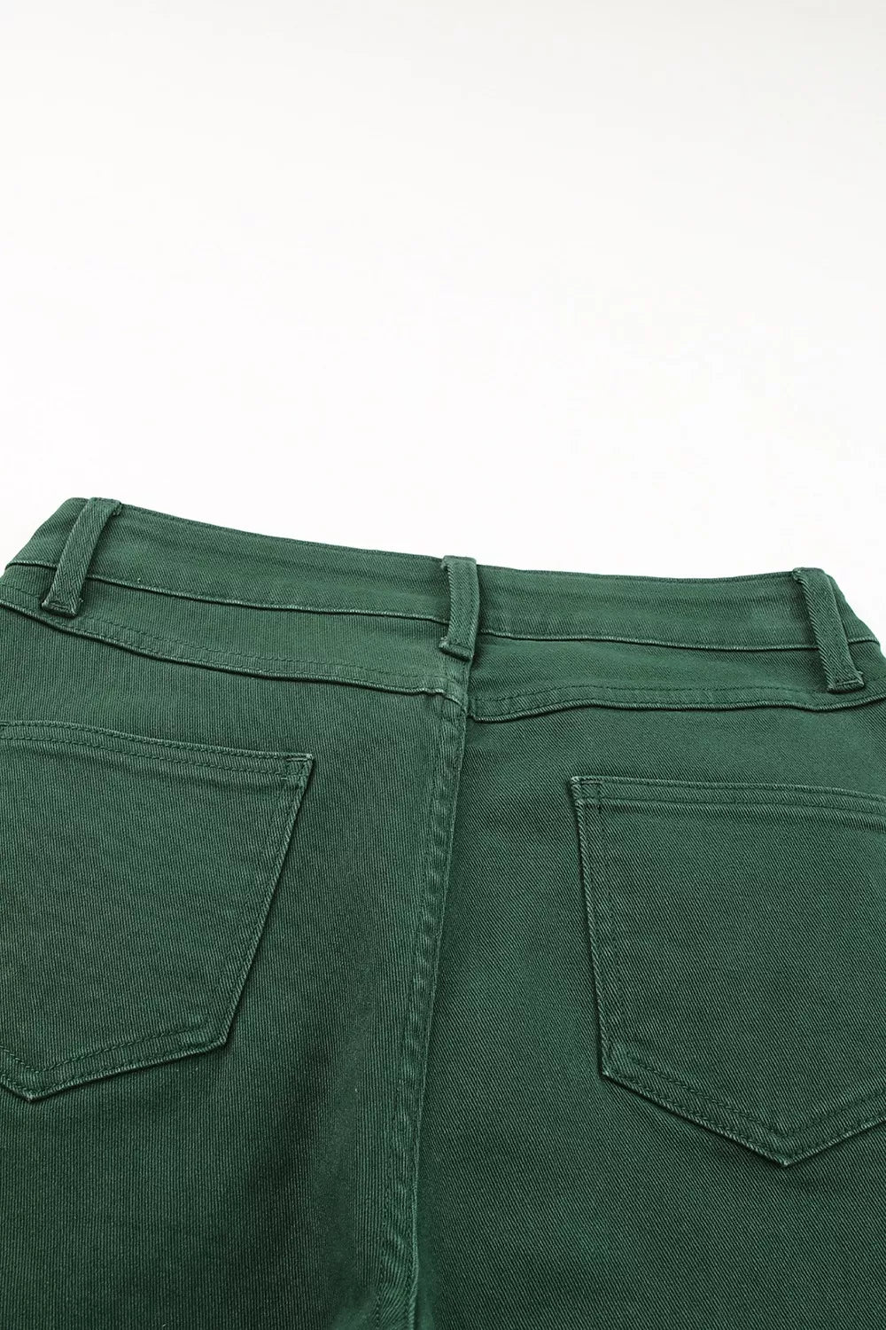 Green cotton straight-leg jeans with crossed v-waist detail and back pockets.