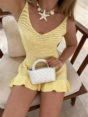 Yellow openwork V-neck sweater dress with frill hem and spaghetti straps.
