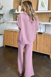 Textured cocoon top and wide leg pants set in dusty pink, back view